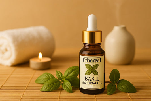 A spa-inspired flat lay with Ethereal Basil Essential Oil bottle, fresh basil leaves, ceramic diffuser, steam hints, and a lit candle on a bamboo mat.