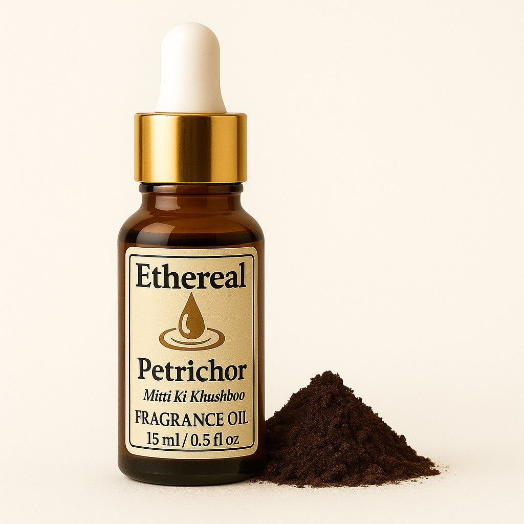 Amber bottle of Petrichor fragrance blend centered on a soft cream background with subtle earthy décor elements on the right — Ethereal label clearly visible