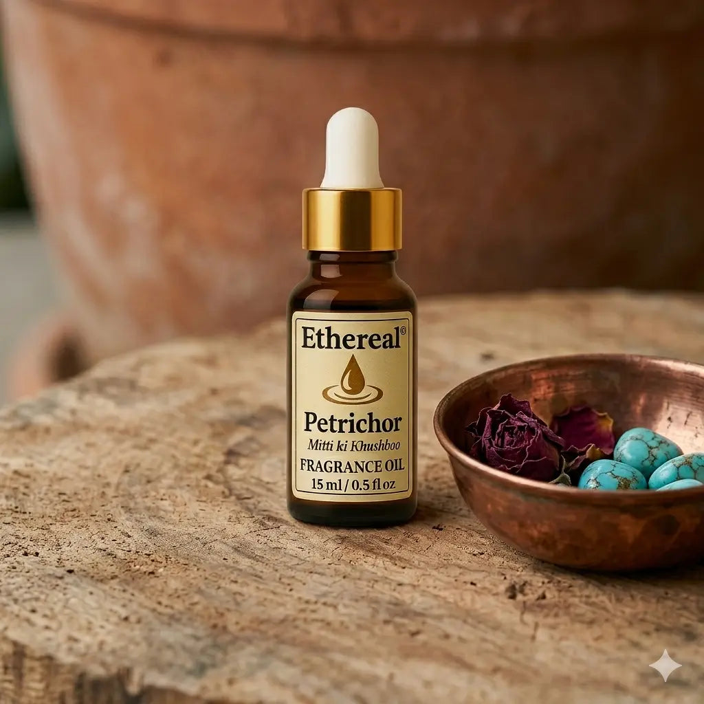 A curated close-up of Petrichor oil with Ayurvedic elements like a copper bowl and rose petals, set for a Pitta cooling ritual