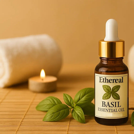Bottle of Ethereal Basil Essential Oil with basil leaves and a candle on a wooden surface for wellness spa aromatherapy