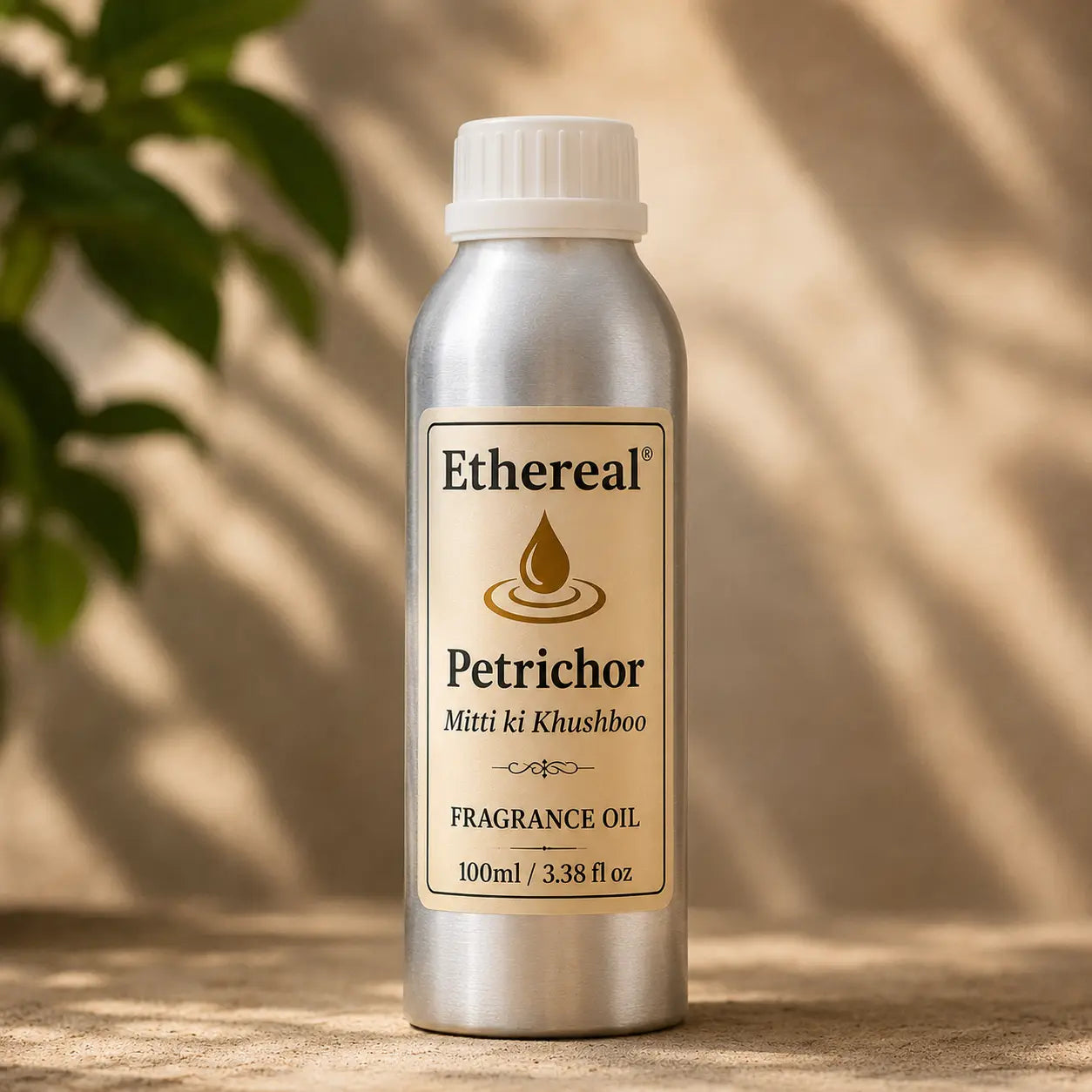 A 100 ml Ethereal Petrichor Fragrance Oil sleek aluminum tin bottle placed on an earthy surface with soft, dappled leaf shadows in the background.