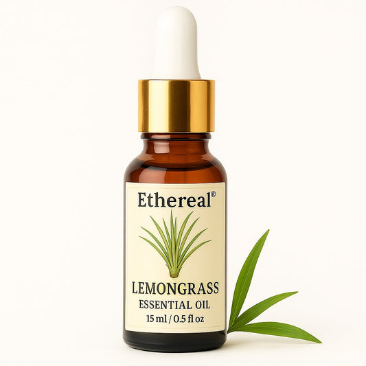 Lemongrass Essential Oil bottle on soft cream background with fresh lemongrass stalks