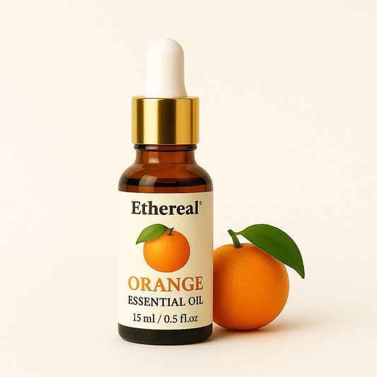 Orange Essential Oil bottle with golden cap and white dropper on off-white background – Shades of Ethereal