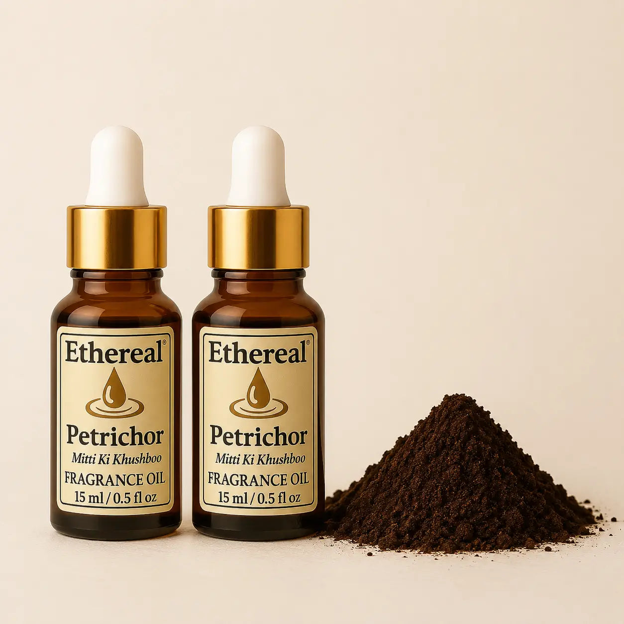 A pair of Ethereal Petrichor amber glass fragrance oil bottles arranged with natural raw earth elements, highlighting a grounding Ayurvedic ritual.